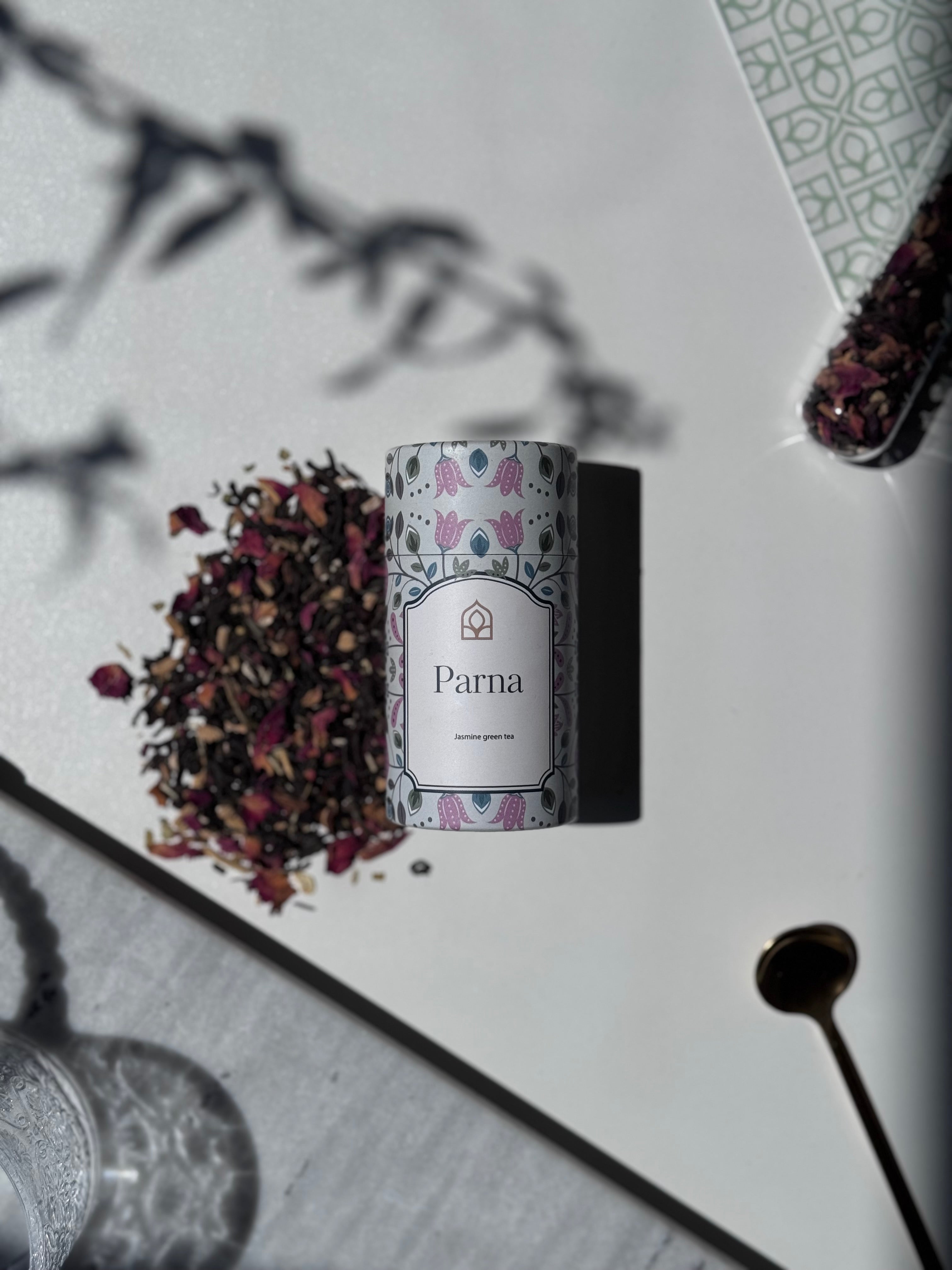 Parna premium green loose leaf tea by Chai's — fresh whole leaves in an elegant canister