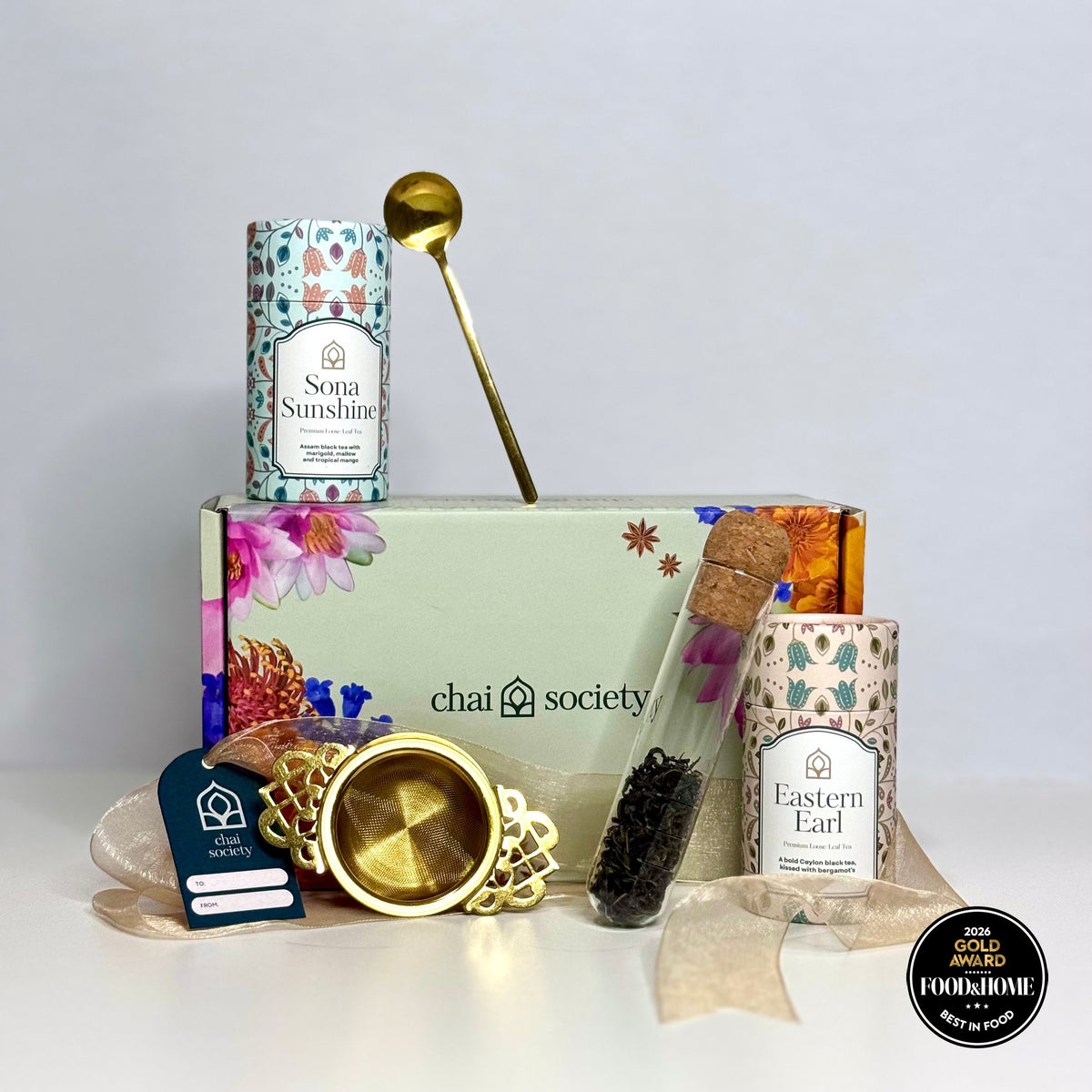 Chai Society tea gift box arranged beside Diwali sweets ready for gifting